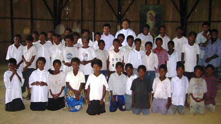 Children of Papua New Guinea Children in the jungle "bush" of Papua New Guinea rejoice together after receiving their First Holy Communion.